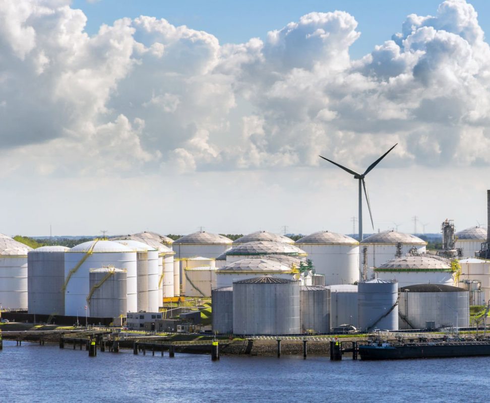 Large port terminal with oil storage silo tanks.